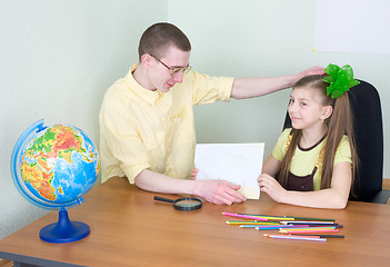 Image showing Girl shows new drawing to the brother