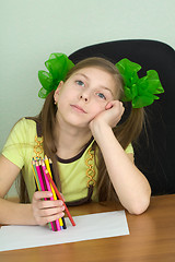 Image showing Girl with color pencils in hands