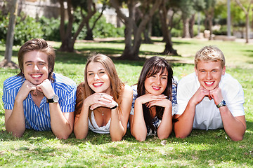 Image showing Four teens with hands on their chin
