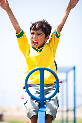 Image showing Smart kid having fun, outdoors
