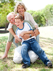 Image showing Grandparents playing with grandson