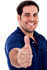 Image showing young man gesturing thumbs up
