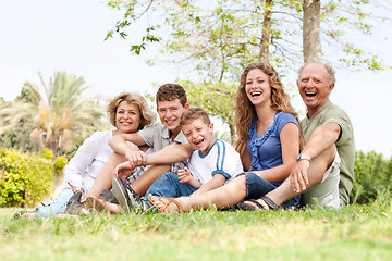 Image showing Affectionate family having fun outdoors