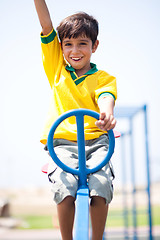 Image showing Young kid enjoying swing ride