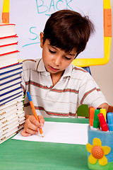 Image showing Young kid busy in drawing