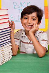 Image showing Young school kid smiling at camera