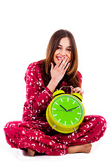 Image showing teenager sitting with alarm clock