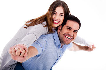 Image showing Young woman enjoying piggyback ride