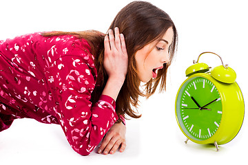 Image showing lady looking at alarm clock