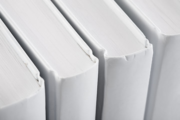 Image showing White backs of books close up