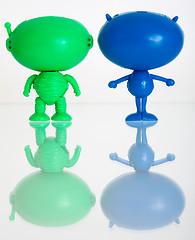 Image showing Two figures of aliens on a white