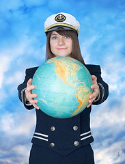Image showing Girl in sea uniform and globe