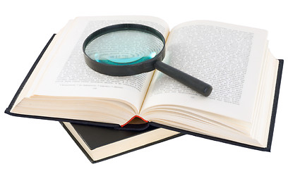 Image showing Open book and magnifier