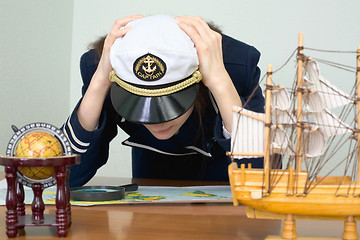 Image showing Girl - the sea captain with a card