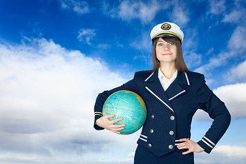 Image showing Girl in sea uniform and globe