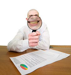 Image showing Guy looks through the big magnifier