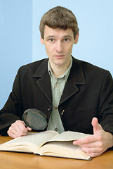 Image showing Man read book on a workplace