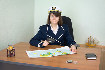 Image showing Girl in the form of sea captain at office