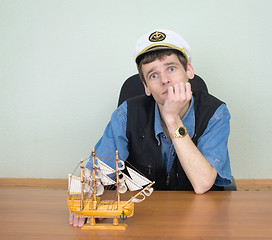 Image showing Man with model of a sailing vessel