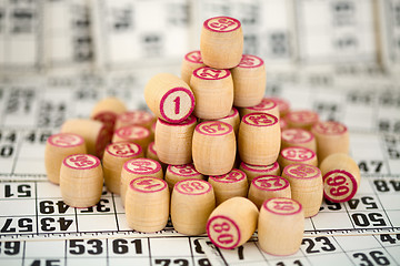 Image showing Wooden counters of bingo on cards