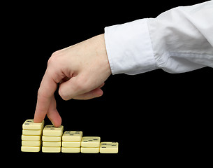 Image showing Ascension on a pedestal from dominoes