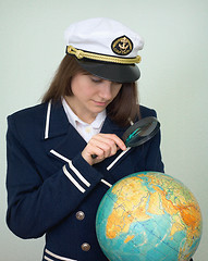 Image showing Girl - the captain examines the globe