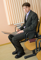 Image showing Person in a suit with the laptop