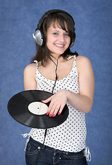 Image showing Young woman in earphones