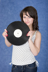 Image showing Portrait of the girl with a phonograph record