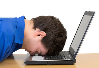 Image showing Young man and laptop