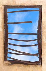 Image showing Old window closed by rusty lattice