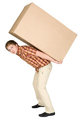 Image showing Young man bears the big box on a back