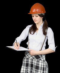 Image showing Young woman in a helmet with a tablet