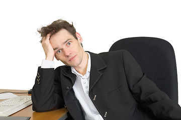 Image showing Sorrowful businessman on a workplace