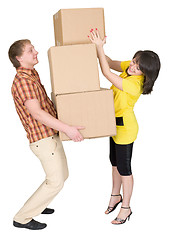 Image showing Girl loads the man with cardboard boxes