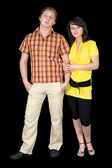 Image showing Serious guy and the girl on a black