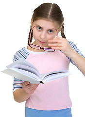 Image showing Schoolgirl with spectacles and book