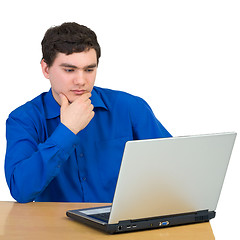 Image showing Young man and laptop