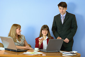 Image showing Girls at a desktop and their chief