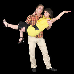 Image showing Young man holds the girlfriend on hands