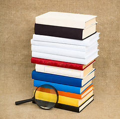 Image showing Books and magnifying glass