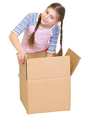 Image showing Girl rummages in a cardboard box