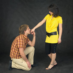 Image showing Man kisses a hand to the woman