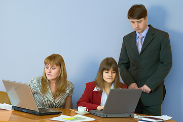 Image showing Girls at a desktop and their chief