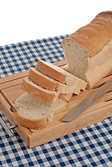 Image showing Slices of bread on top of wooden board