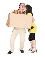 Image showing Girl kisses the guy holding a box