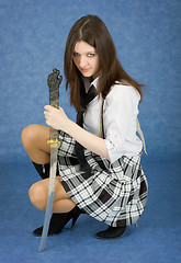 Image showing Beautiful girl in a skirt with the Japanese sword