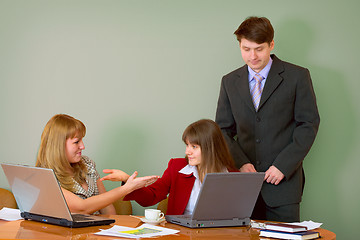 Image showing Girls at a desktop and their chief