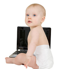 Image showing Baby sitting on a white background with laptop