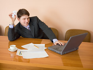 Image showing Businessman on a workplace with the laptop